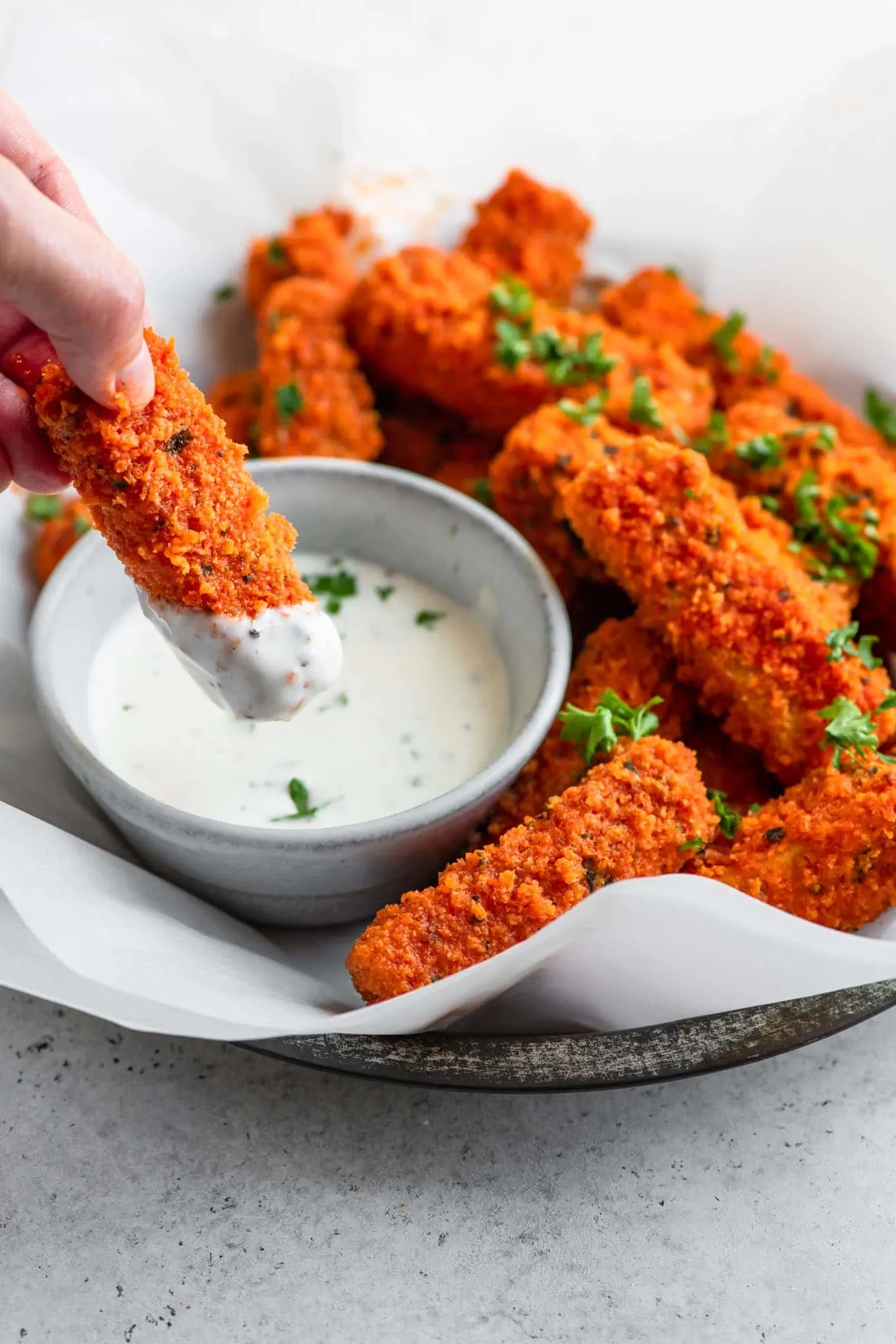 buffalo tofu wing dipped in sauce