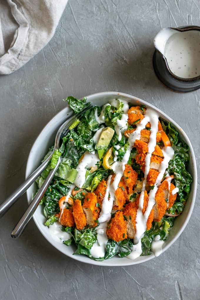 Crispy baked buffalo tofu wings with a romaine and avocado salad and vegan bleu cheese dressing.