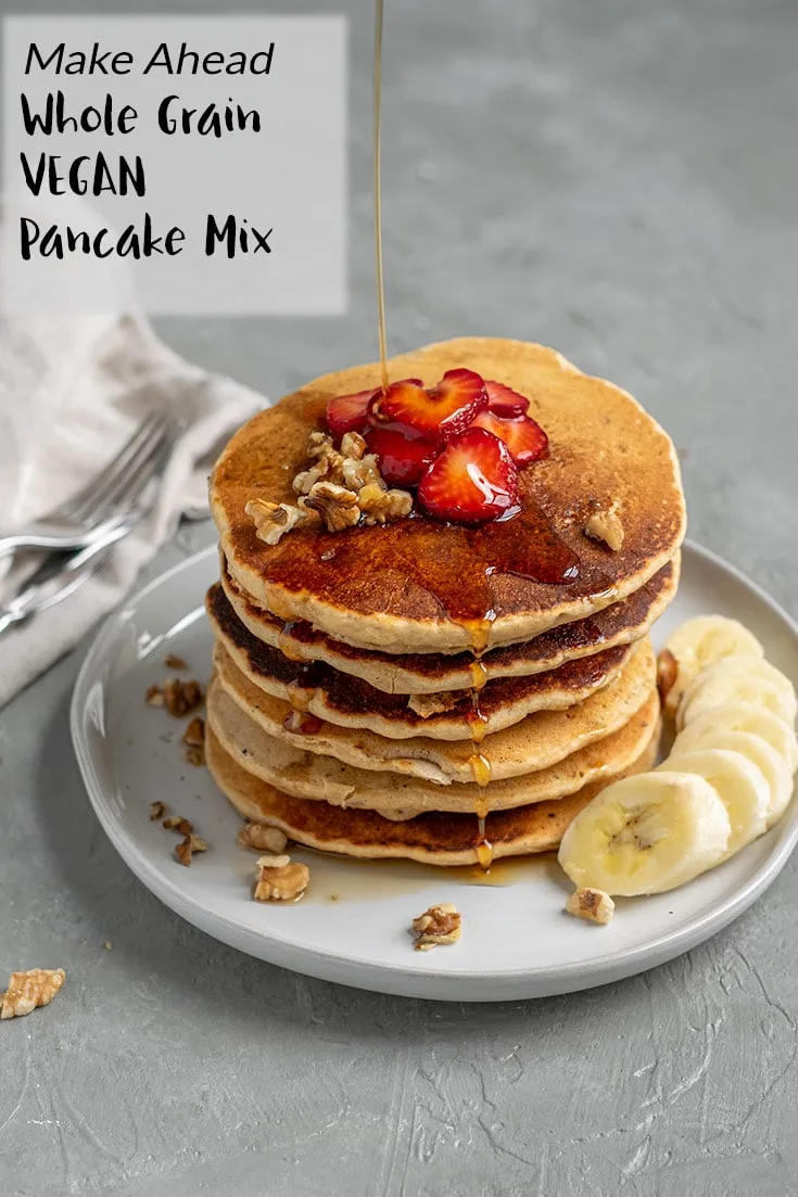 These fluffy whole grain pancakes are made with whole wheat pastry flour and cornmeal and stuffed with walnuts for a delicious and hearty vegan breakfast. Make the dry mix ahead of time for quick pancakes whenever you want! | thecuriouschickpea.com #veganbrunch #breakfast #vegan #pancakes #wholegrain