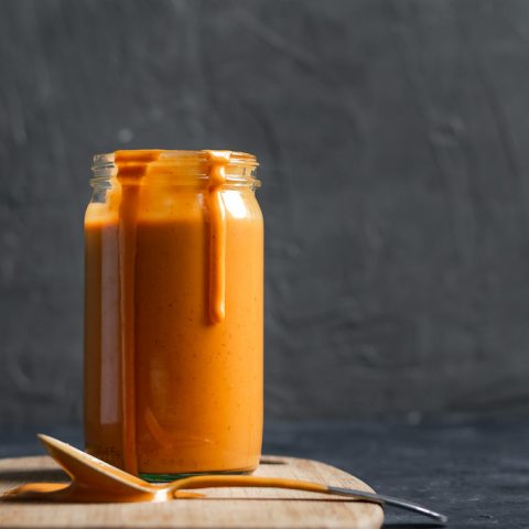 Creamy Mexican chipotle sauce made with aquafaba served in a glass jar.