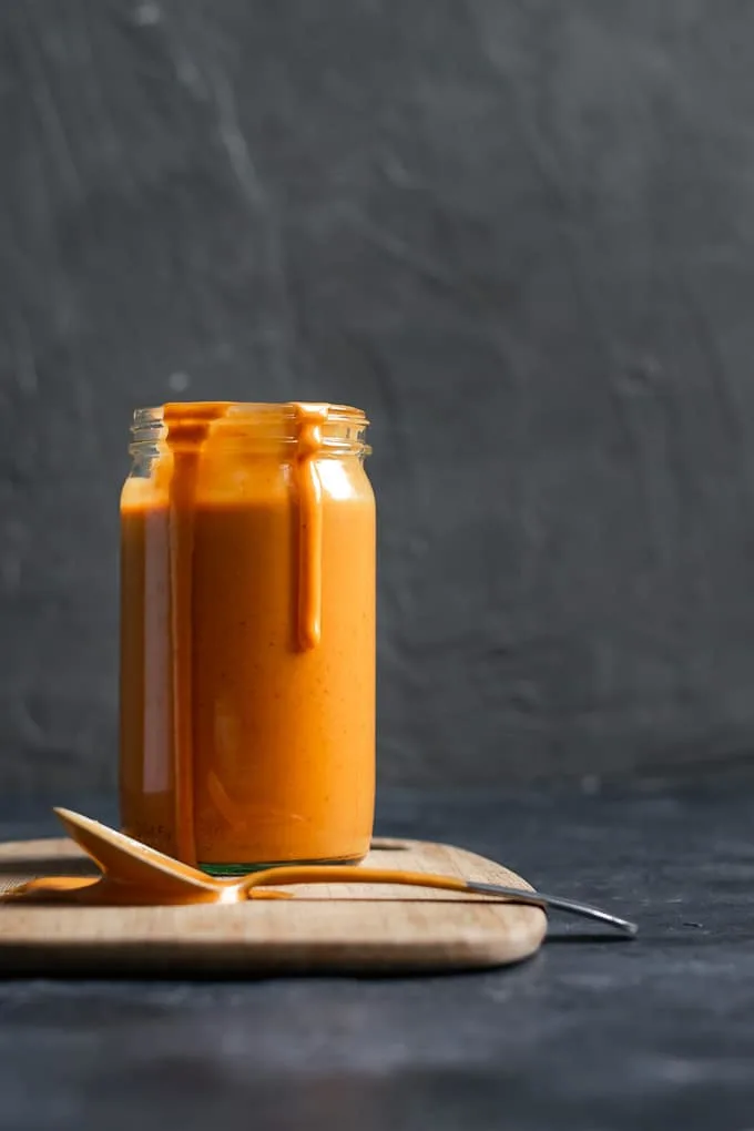 Creamy Mexican chipotle sauce made with aquafaba served in a glass jar.