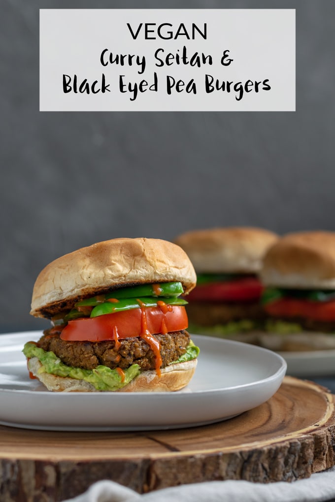 This hearty vegan curry flavored burger is made of seitan and black eyed peas for a fast protein-packed & mouth watering meal! Gluten free option included. | thecuriouschickpea.com #vegan #veggieburger #veganburger #curry #seitan #beans