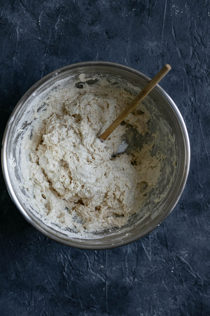 vegan homemade restaurant style naan dough, just mixed together with a wooden spoon