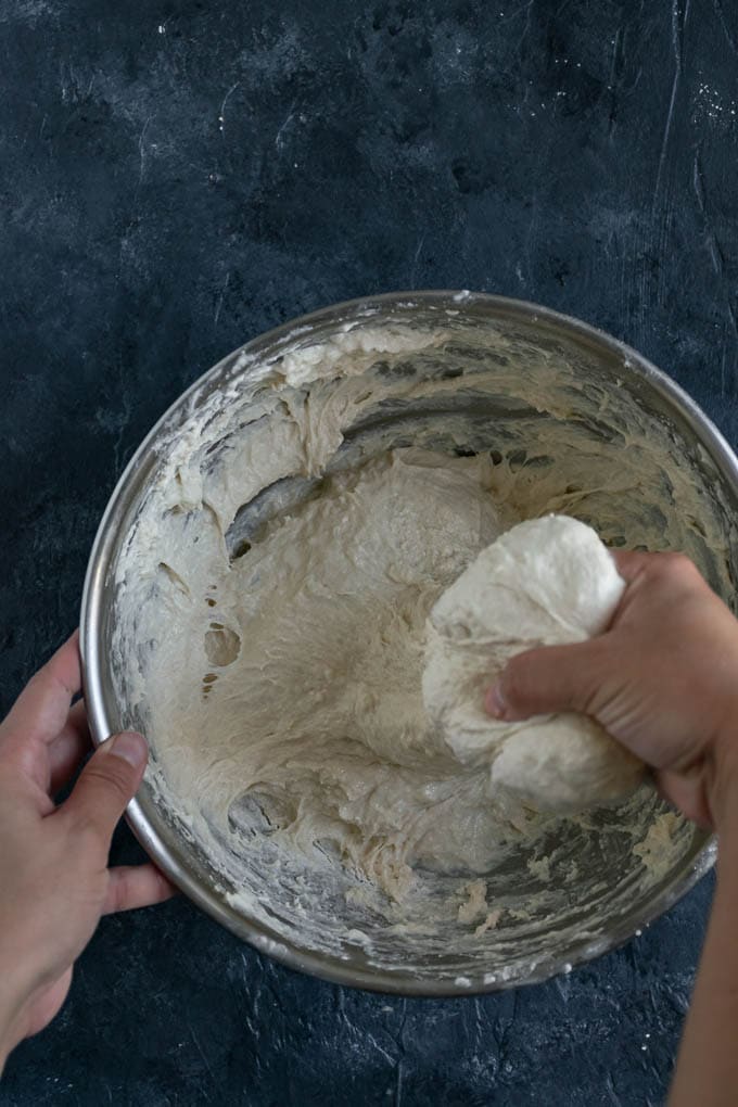 kneading the wet naan dough
