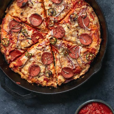 vegan pepperoni pan pizza in cast iron skillet