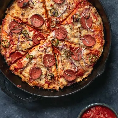 vegan pepperoni pan pizza in cast iron skillet