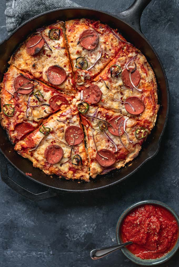 vegan pepperoni pan pizza in cast iron skillet