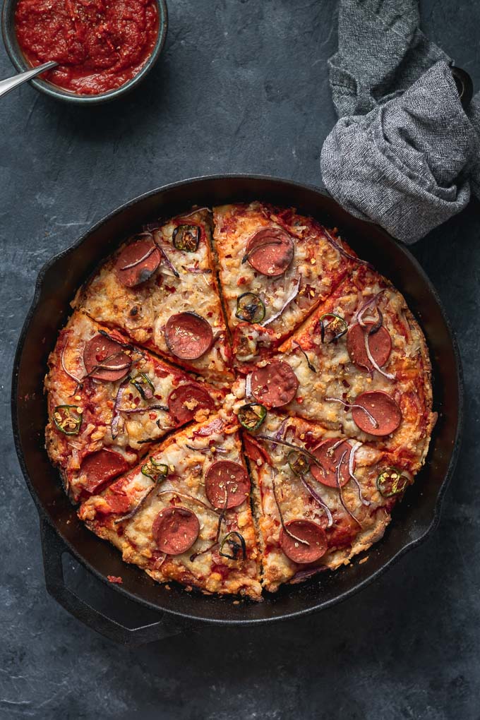 vegan pepperoni pan pizza in cast iron skillet