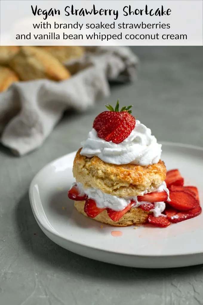 Buttery shortbread biscuits are topped with sweet, brandy soaked strawberries and finished off with some freshly whipped vanilla bean coconut whipped cream for a delicious vegan summery dessert. | thecuriouschickpea.com #vegan #dessert #strawberryshortcake #sweet