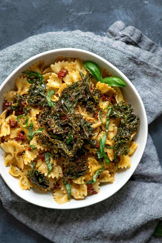 Sun dried tomato and kale pesto pasta with pesto crusted kale chips