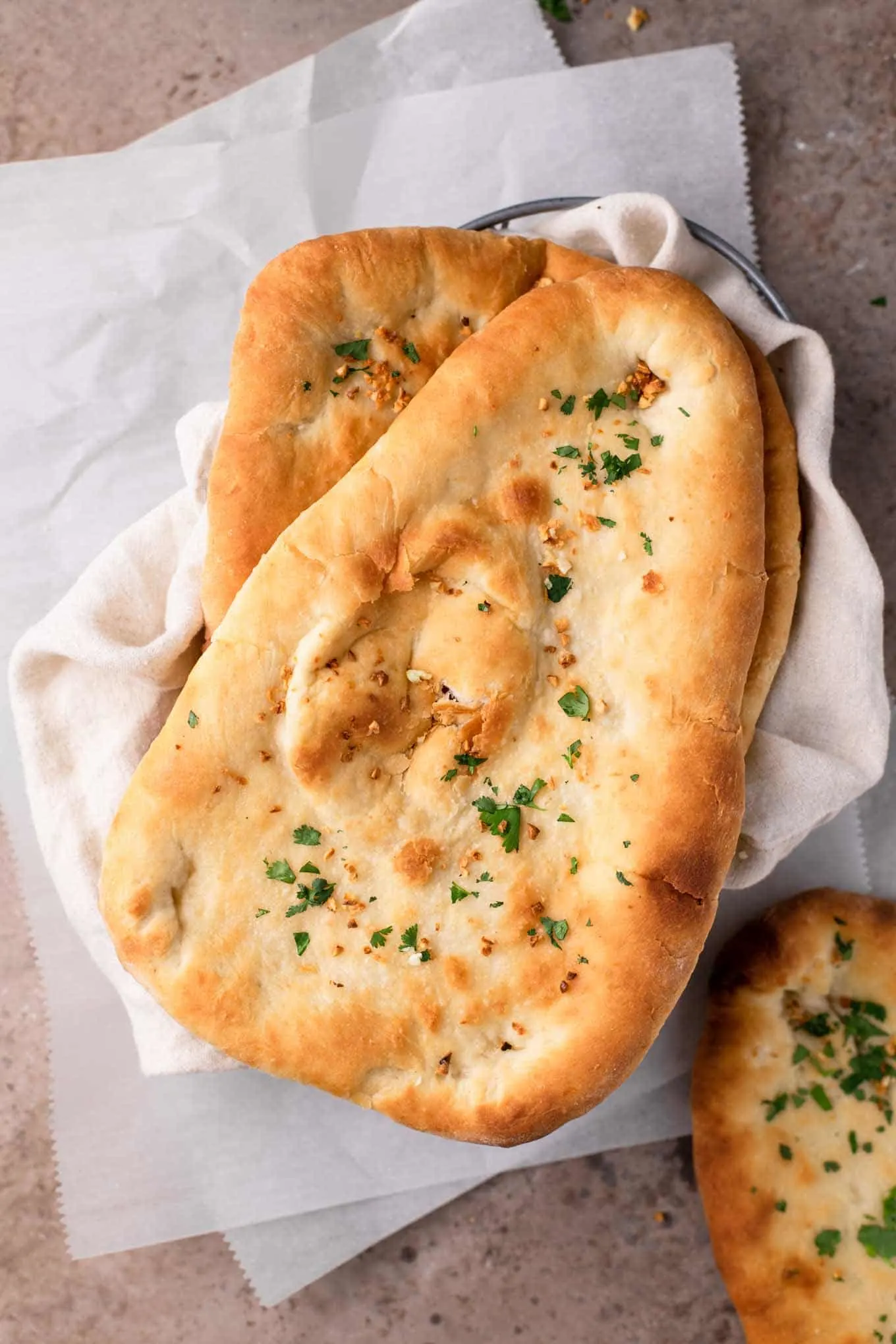 vegan garlic naan in a bread basket