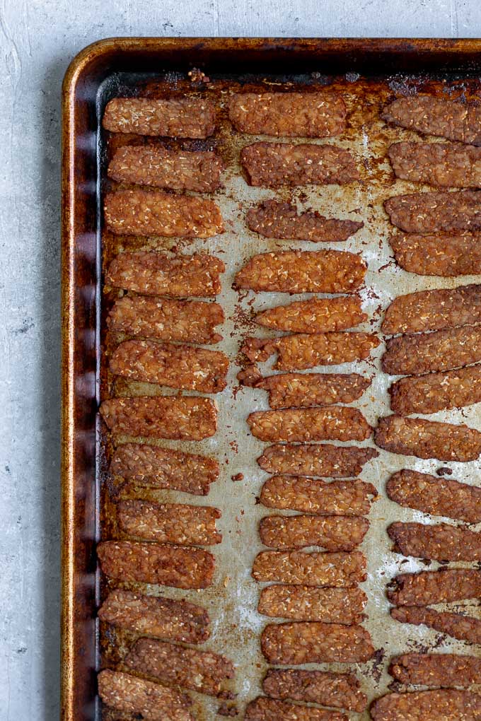 baked tempeh bacon on pan