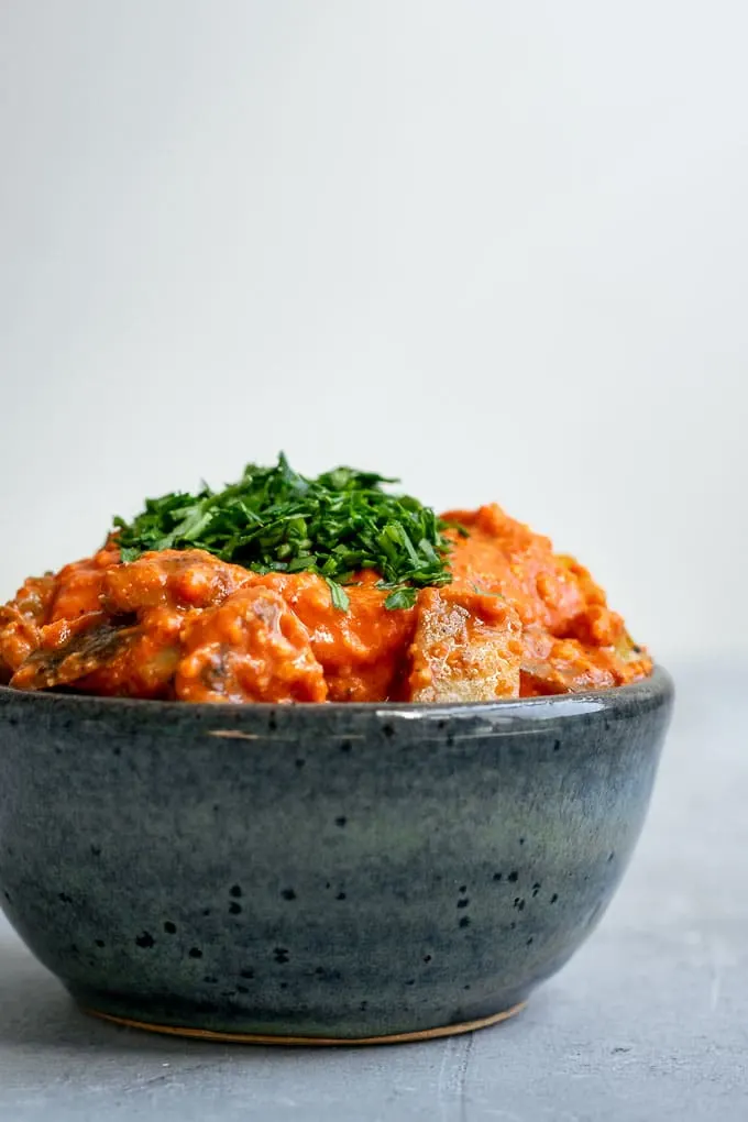 Easy romesco sauce on pan fried potatoes and garnished with parsley