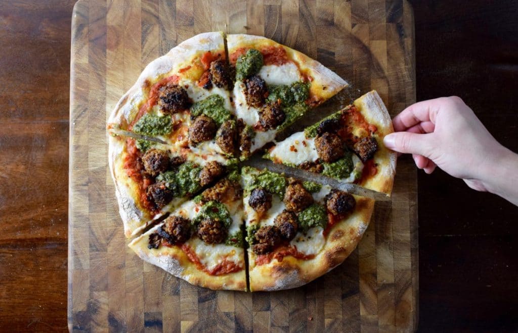 Vegan chickpea meatball pepita pistachio arugula pesto pizza