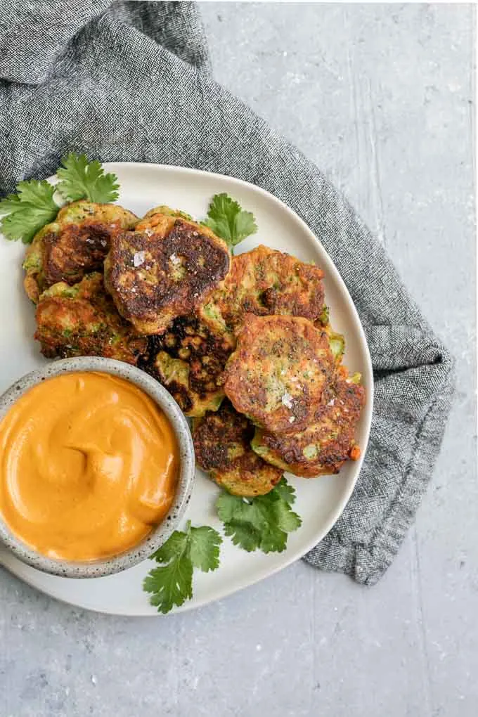 vegan broccoli fritters with smokey red pepper buffalo cheddar dip