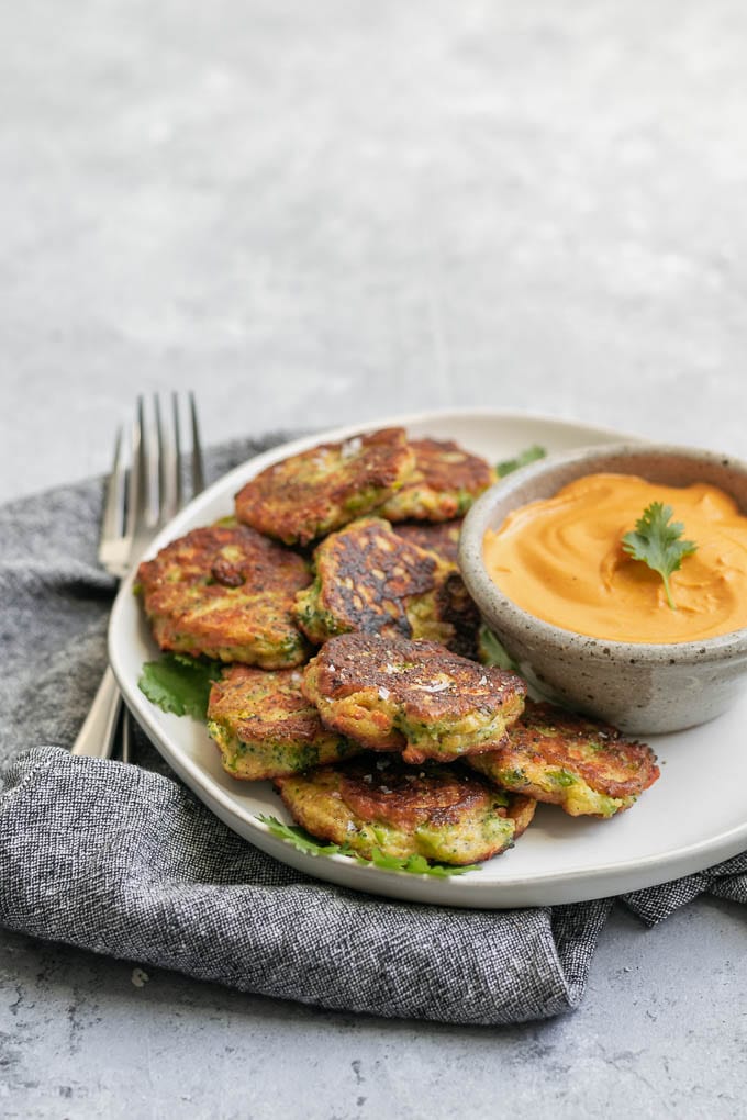 vegan broccoli fritters with smokey red pepper buffalo cheddar dip