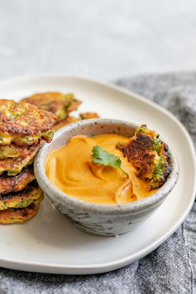 vegan broccoli fritters with smokey red pepper buffalo cheddar dip