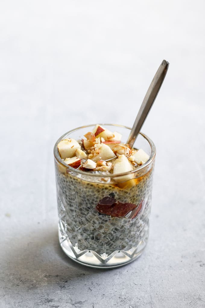 Vanilla chia pudding with chopped pears, hazelnuts, and maple syrup from the cookbook Vegan Reset by Kim-Julie Hansen