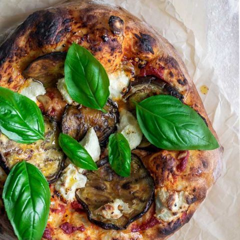 vegan roasted eggplant pizza with almond ricotta, roasted garlic, and chili oil