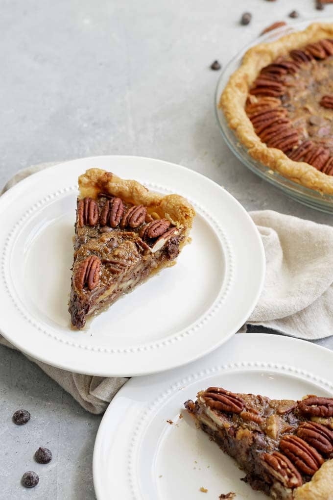 two slices of vegan chocolate bourbon pecan pie