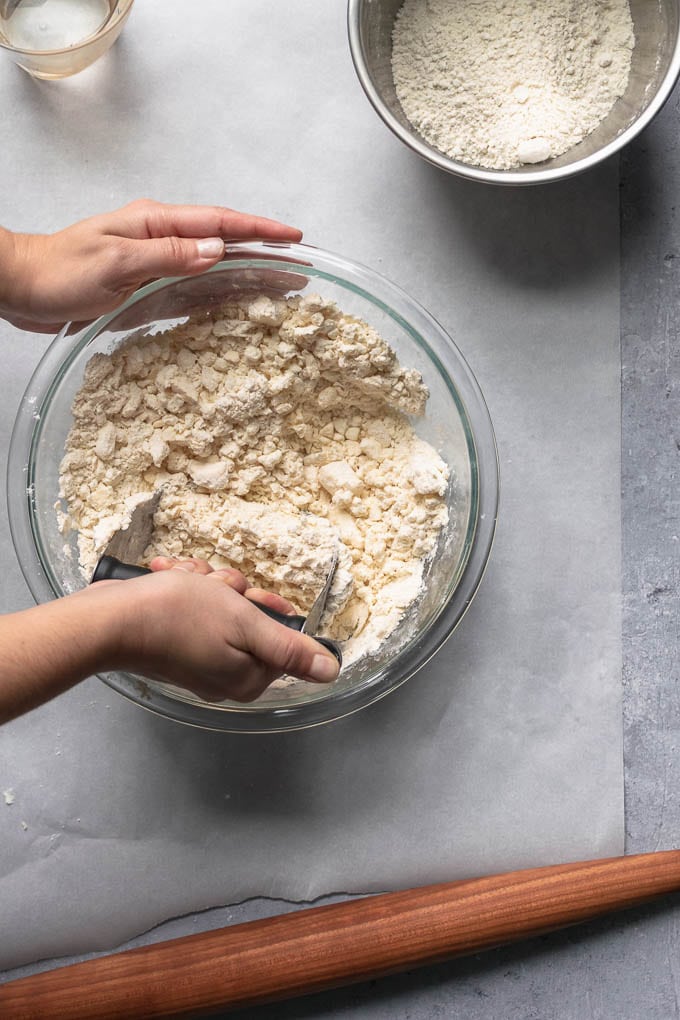 using a pastry blender to cut the fat into the flour