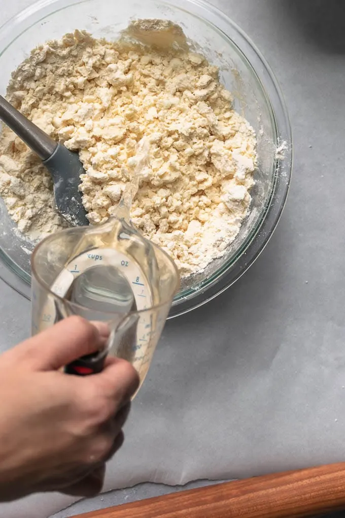 adding water to the blended fat and flour