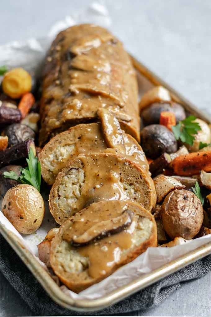 seitan roast stuffed with chestnut and white wine risotto topped with mushroom gravy and served with roasted vegetables