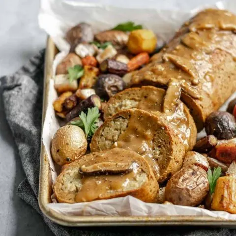 seitan roast stuffed with chestnut white wine risotto topped with mushroom gravy and served with roasted vegetables