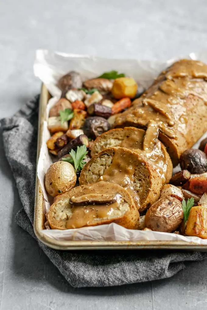 seitan roast stuffed with chestnut white wine risotto topped with mushroom gravy and served with roasted vegetables