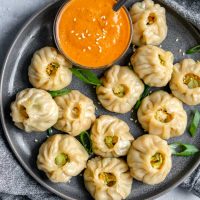 Tibetan vegetable momo served with a spicy sesame chutney