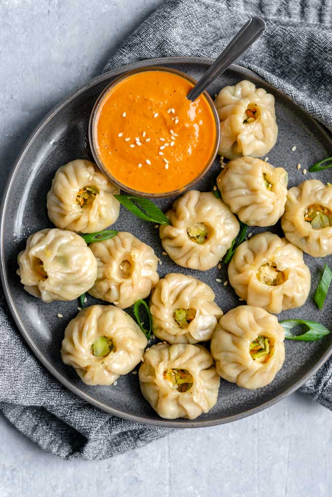 Tibetan vegetable momo served with a spicy sesame chutney