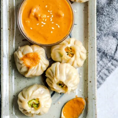 Tibetan vegetable momos with a spicy sesame tomato chutney