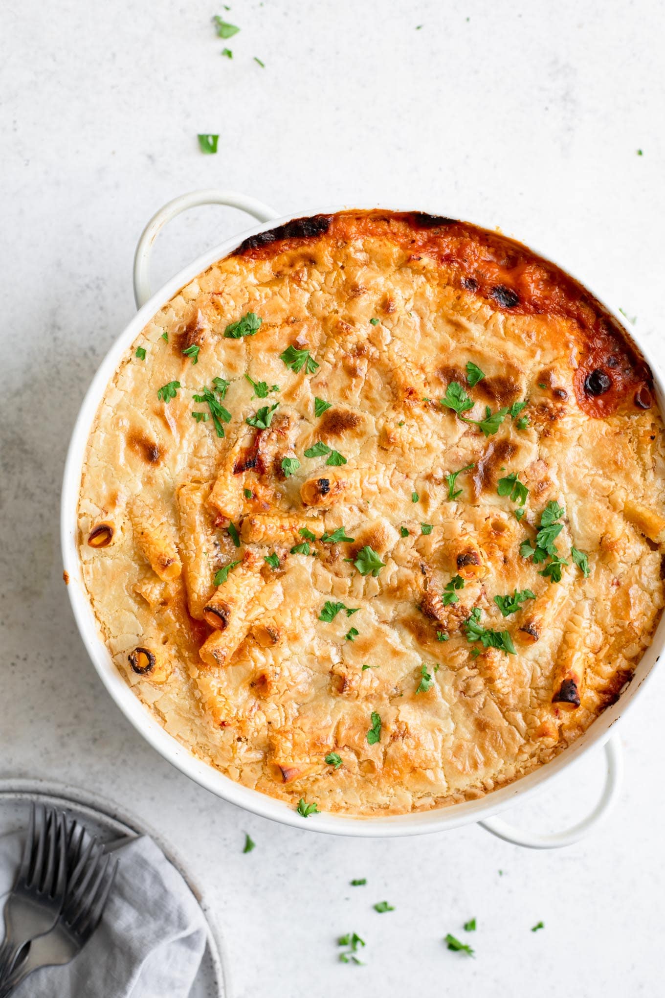 vegan baked ziti garnished with parsley