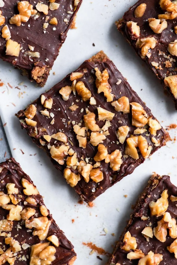 close up overhead view of the bars showing chocolate and chopped wanut topping