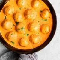 vegan chickpea meatballs in roasted red pepper sauce