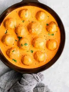 vegan chickpea meatballs in roasted red pepper sauce