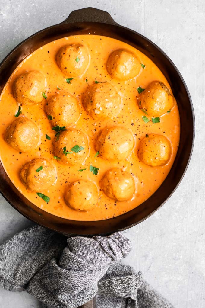 vegan chickpea meatballs in roasted red pepper sauce