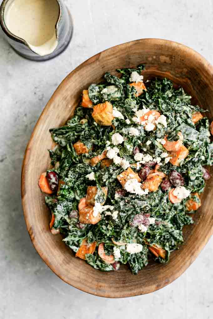 kale salad with roasted garlic tahini dressing, ancho roasted sweet potatoes, and kidney beans