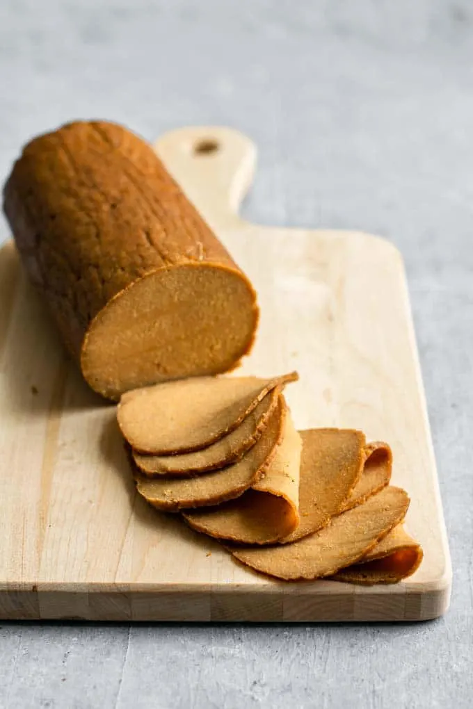 homemade seitan deli meat slices, thinly sliced from the loaf