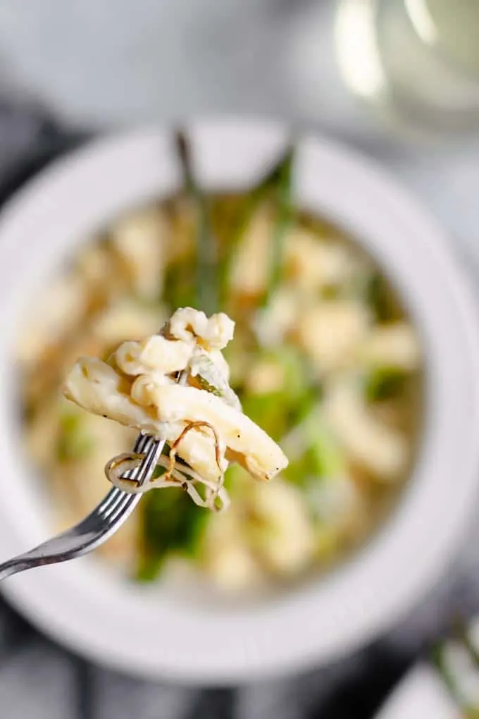 close up of a forkful of the creamy pasta