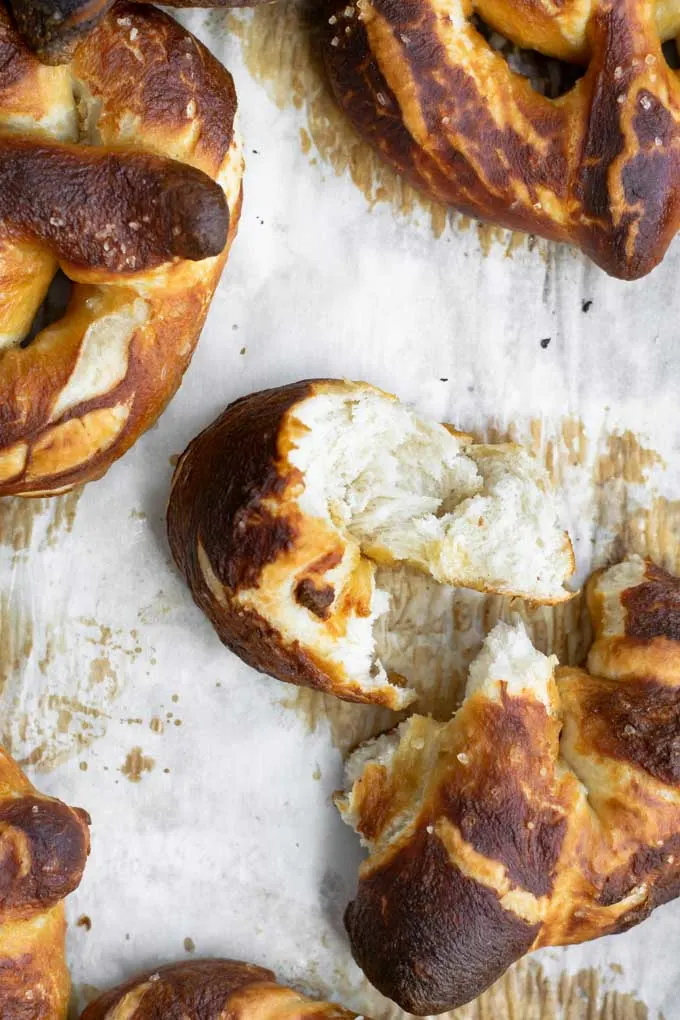 close up of a soft pretzel torn to show the texture