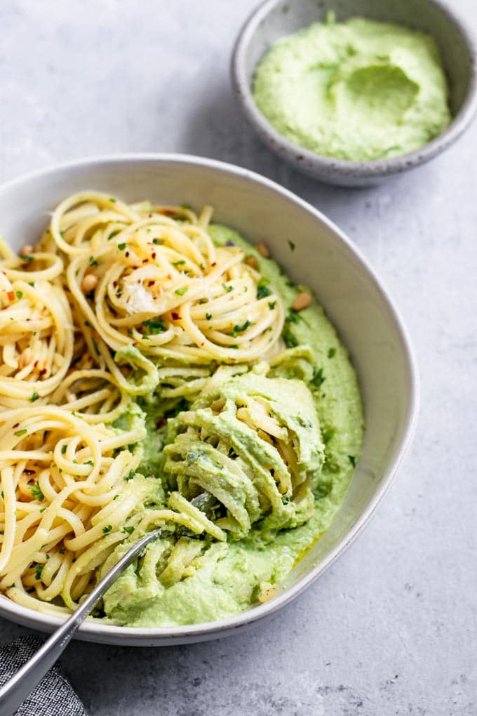 garlic linguine twirled through the whipped pea ricotta so that it's on the pasta