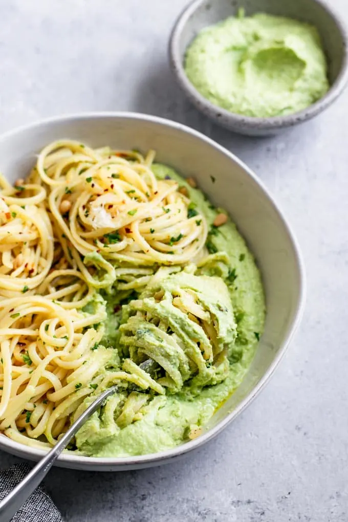 garlic linguine twirled through the whipped pea ricotta so that it's on the pasta