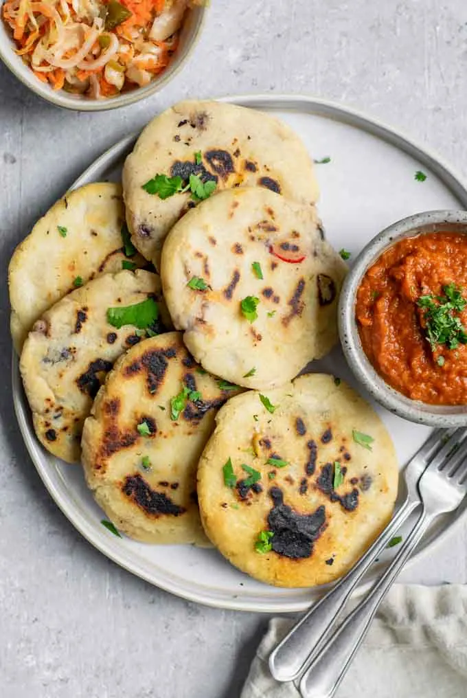 homemade pupusas with salsa roja and cabbage slaw