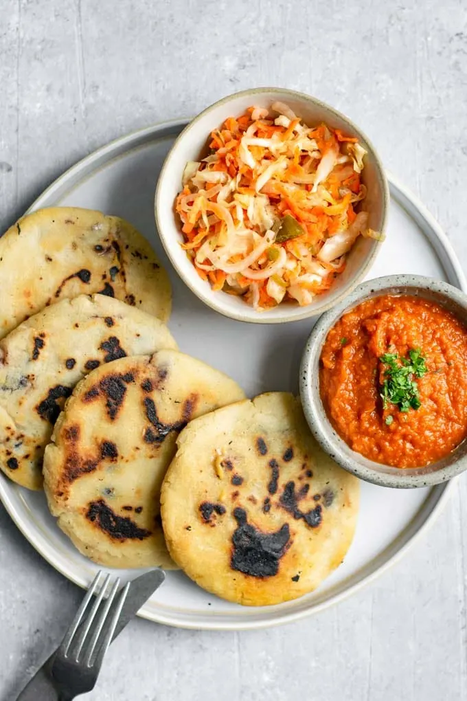 salvadorian curtido served with pupusas and salsa roja