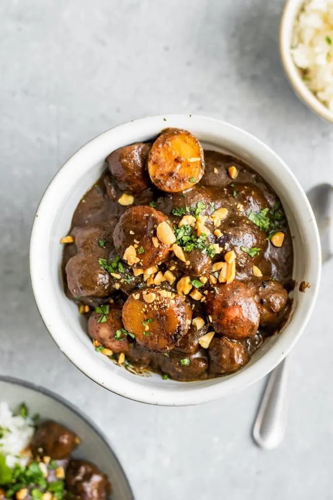 massaman curry with vegan beef served in a white bowl