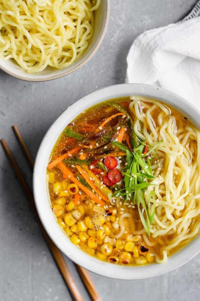 vegan ramen with miso tahini broth, charred corn, and carrots and jalapeño