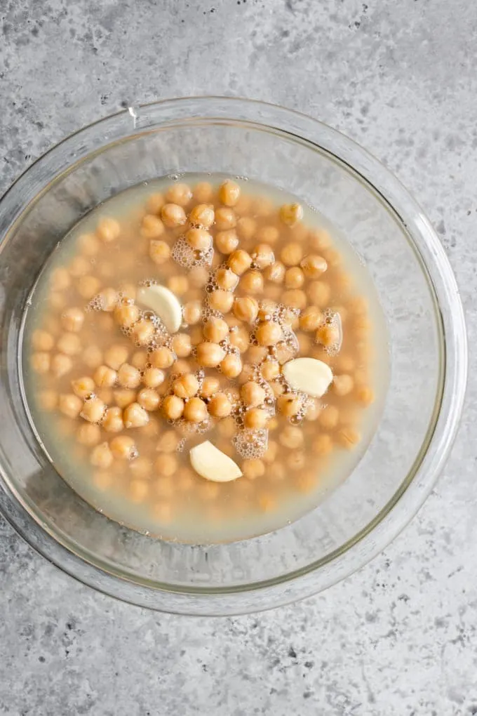 chickpeas in their cooking or canned liquid and garlic