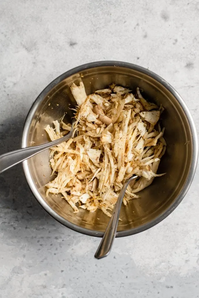 shredded king oyster mushrooms tossed with a dry rub and olive oil