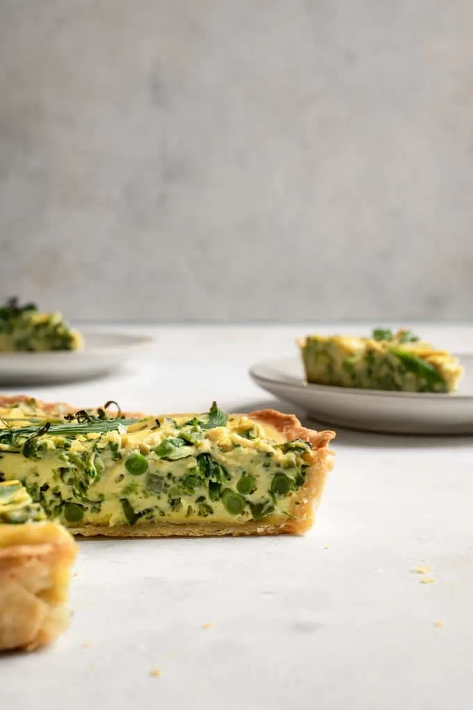 side view of the quiche, showing the texture and the sprouting broccoli stems